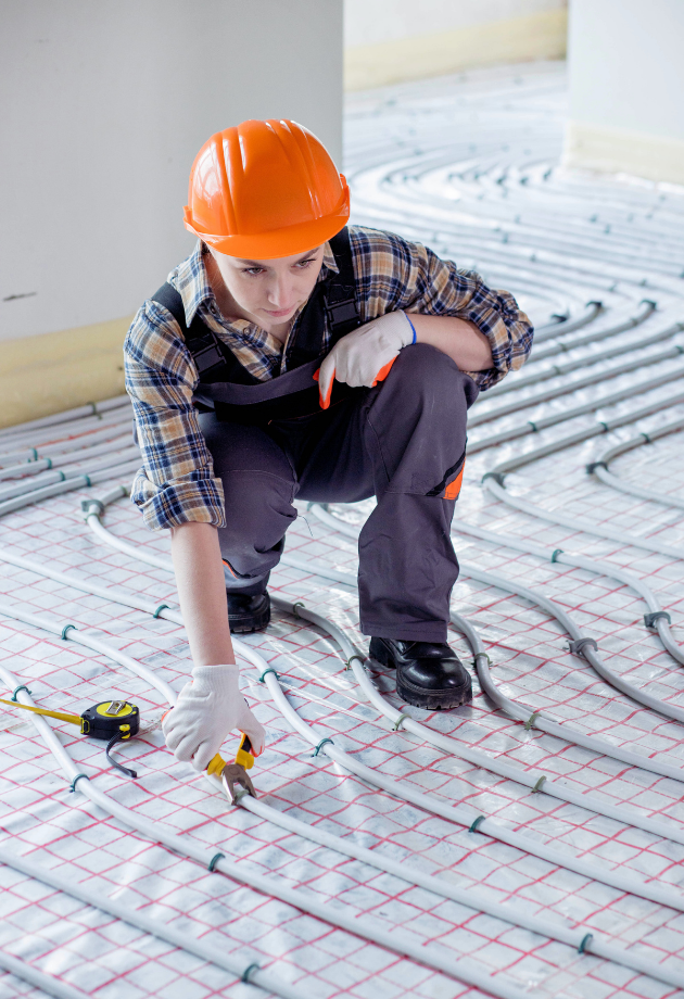 contractor taking measurements on floor
